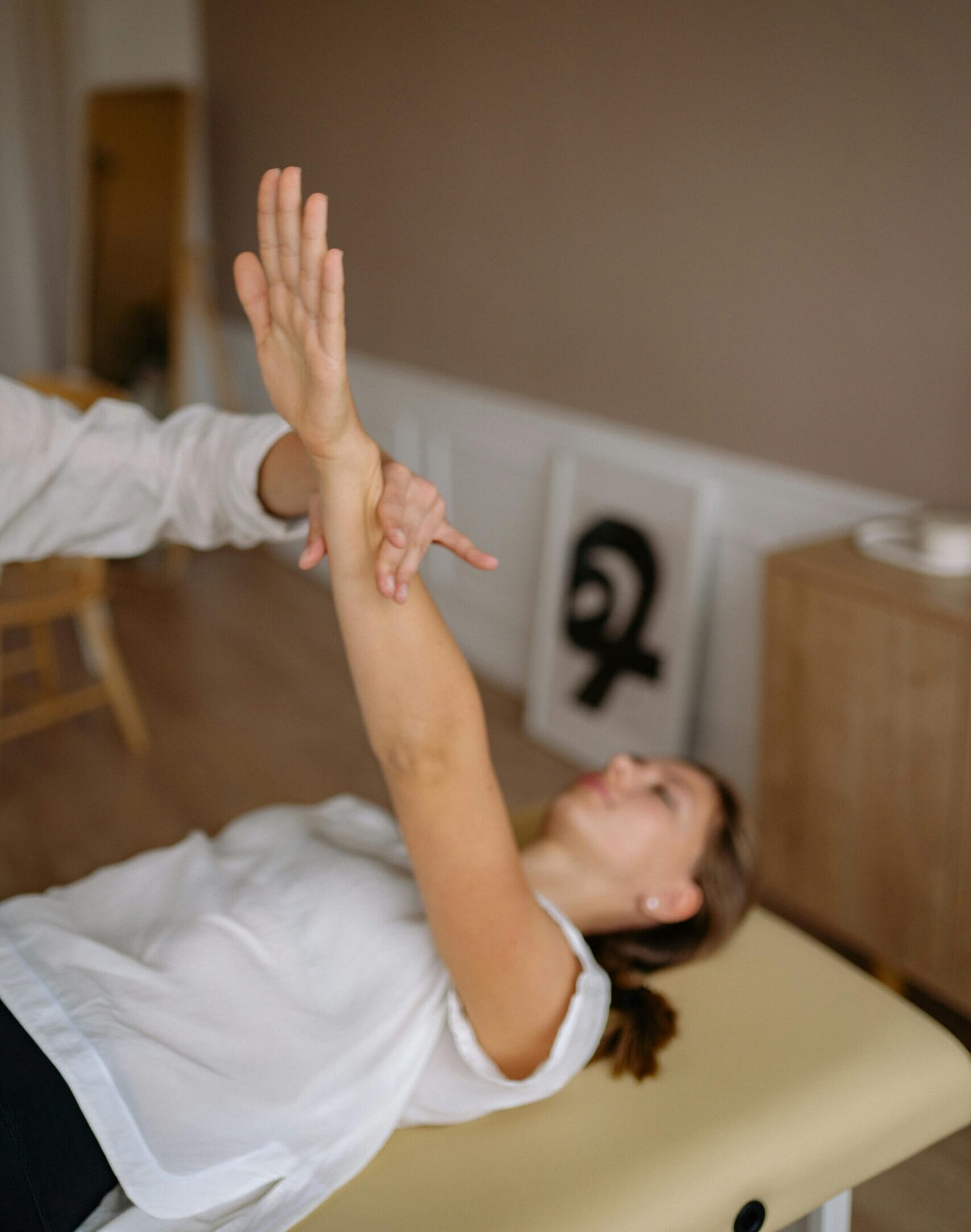 pexels-yankrukov-5793922-scaled-e1760972444444 A therapist performing an upper body stretch during a sports massage in Melbourne, demonstrating techniques to enhance flexibility and relieve muscle tension.
